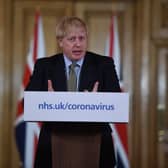 British Prime Minister Boris Johnson gestures (Photo by Eddie Mulholland - WPA Pool/Getty Images)