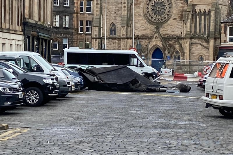 After the winds swept the roof away from the buildings above, the roof appears to have collapsed onto cars parked on Iona Street near St. Paul's church on Pilrig Street.