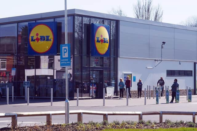 A new Lidl supermarket could be built in Sheffield, if plans are approved. Stock picture of people social distancing at a Lidl supermarket. Picture: Brian Eyre
