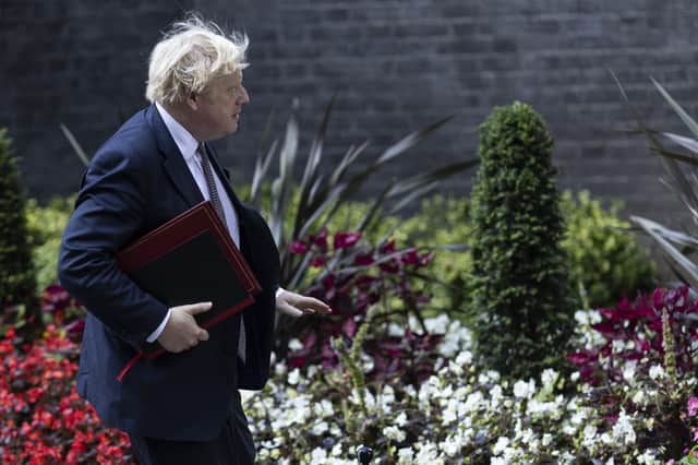British Prime Minister Boris Johnson leaves Downing Street to host a virtual G7 meeting on Afghanistan at British Foreign and Commonwealth Office on August 24, 2021 in London, England. (Photo by Dan Kitwood/Getty Images)