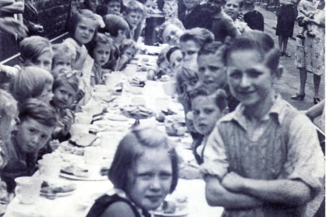 A VE Day street party in Bellefield Lane, Sheffield. Pictured on the left is Jean Ingleston (later Jean Jukes, now deceased) and her sister Christine. Submitted by Jean's husband, John Jukes