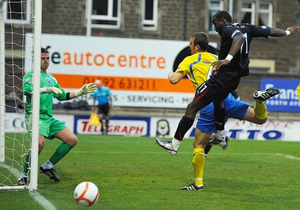 Gregory Tade goes close with an header against Queens back in 2010.