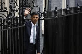LONDON, ENGLAND - OCTOBER 25: British Prime Minister Rishi Sunak waves to the media following a statement after taking office outside Number 10 in Downing Street on October 25, 2022 in London, England. Rishi Sunak will take office as the UK's 57th Prime Minister today after he was appointed as Conservative leader. (Photo by Jeff J Mitchell/Getty Images) *** BESTPIX ***