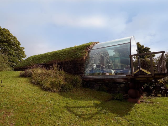 The unique building has a turfed roof, helping it blend into the landscape