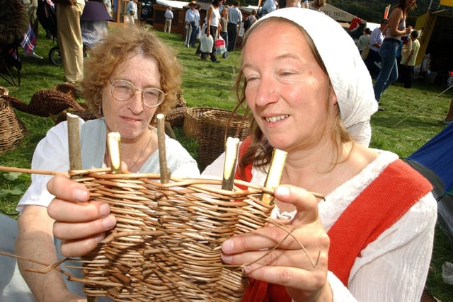 Judith Lockett and Margaret Cooper making a willow base for a square basket in 2004
