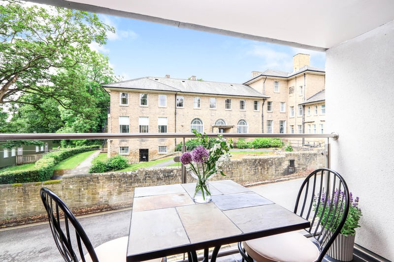 The balcony is described as delightful, with glass and steel balustrade and slate flooring.