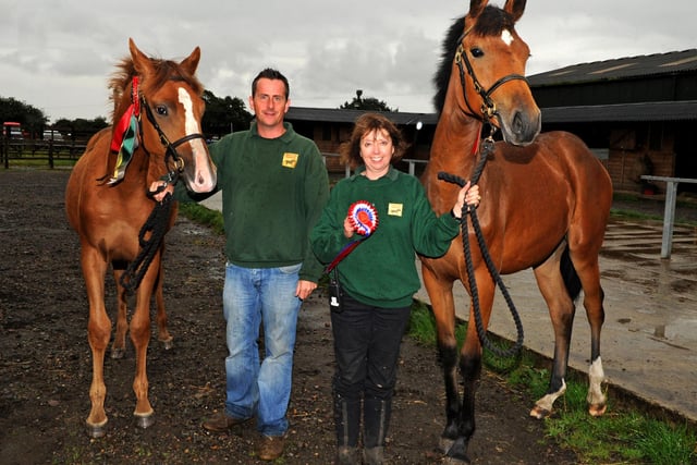 Cheryl Williams and John Minion (Directors of the park) and their two young horses ( left Stan and Stella ) who are growing up there with lions within ear shot in 2012
