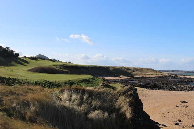 East Lothian's Glen Golf Course is a cliff top links course with views of the Bass Rock which regularly offers twilight tee times at a discount rate.
