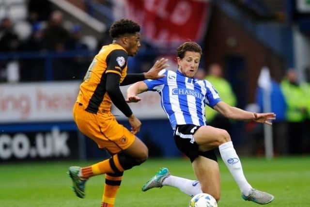 Sam Hutchinson, who is leaving Sheffield Wednesday, in typical pose - flying into a challenge