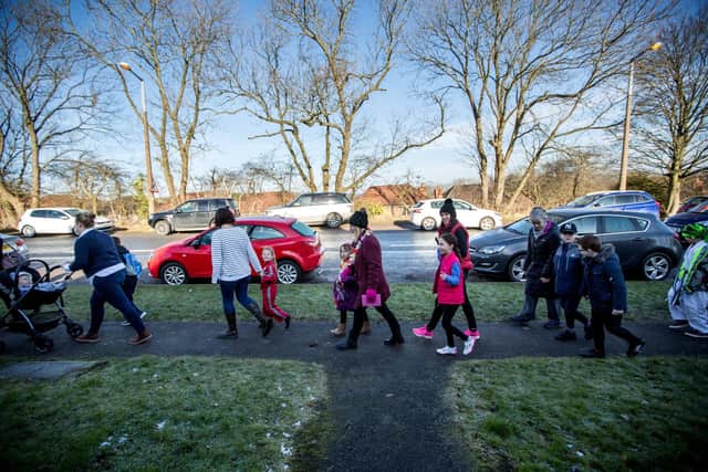 Families walking to school pre-Covid