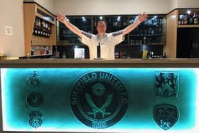 Dougie Hodgson shows off his Sheffield United themed bar at home in Australia