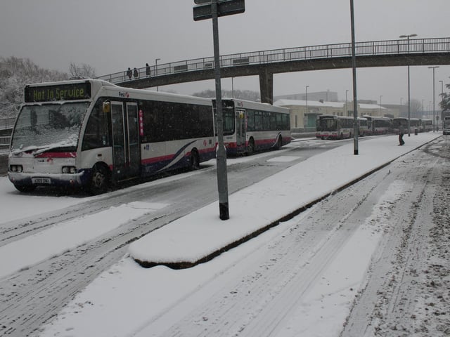 Out of service First buses get a wintry coat as they sit still in Hilsea, near the Portsbridge Roundabout.