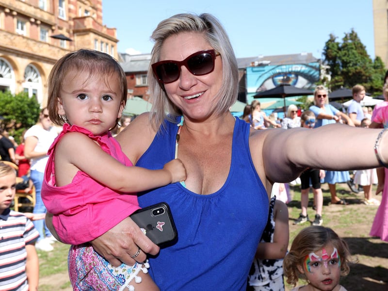 The weather was wonderful for the party. Lani Mullen dancing with her daughter, Grace, one.