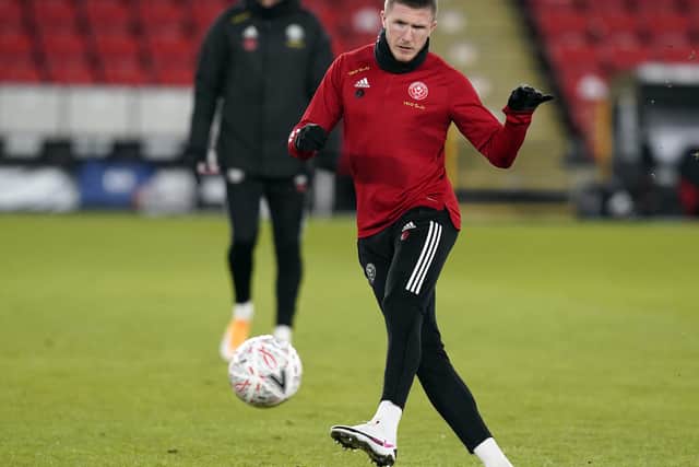 John Lundstram is expected to face Aston Villa at Bramall Lane: Andrew Yates/Sportimage