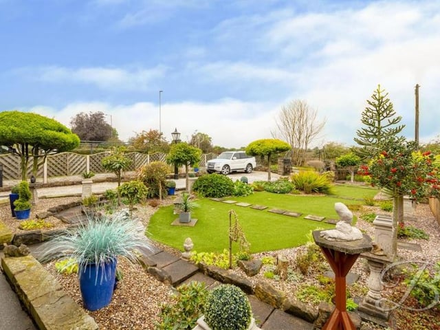 Our last shot of the Abbott Road chalet-type bungalow gives a good view of the finely manicured front garden. Complete with lawn, decorative shrubs, trees and paving.