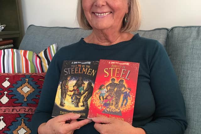 Theresa Tomlinson with her books Meet Me by the Steelmen and Forged in Steel