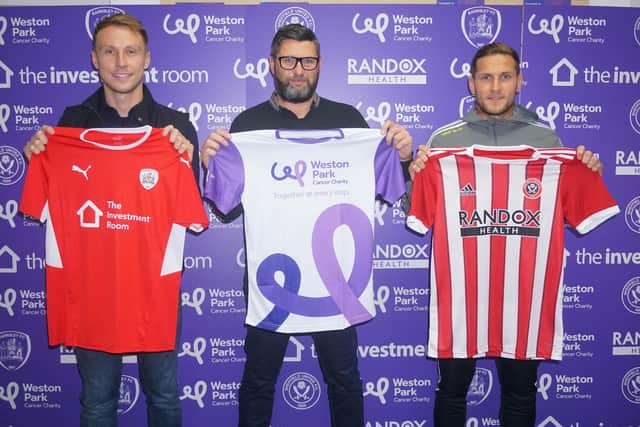 Sheffield United and Barnsley football club have teamed up to support Weston Park Cancer Charity in a region-first partnership. Pictured are Billy Sharp (Right) and Cauley Woodrow (left) with Darren Hayes of Weston Park Cancer Charity.
