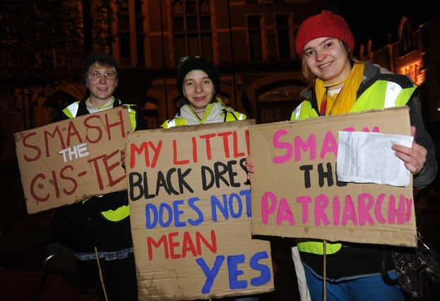 (l-r) Ellen McGovern, Sabine Sharp and Charlotte Sisman with their banners for the Reclaim the Night march by Sheffield University Student Union. Picture: Andrew Roe