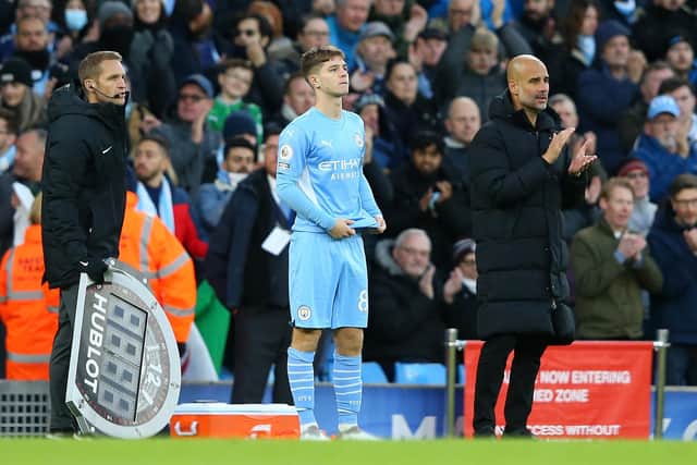 James McAtee of Manchester City with boss Pep Guardiola (Alex Livesey/Getty Images)