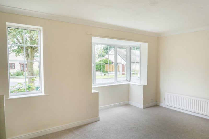 Front facing lounge with large bay window and side window bringing in lots of natural light, wall lights, tv point, coving and central heating radiator.  Perfect space to sit and relax with family and friends and leading into the dining area