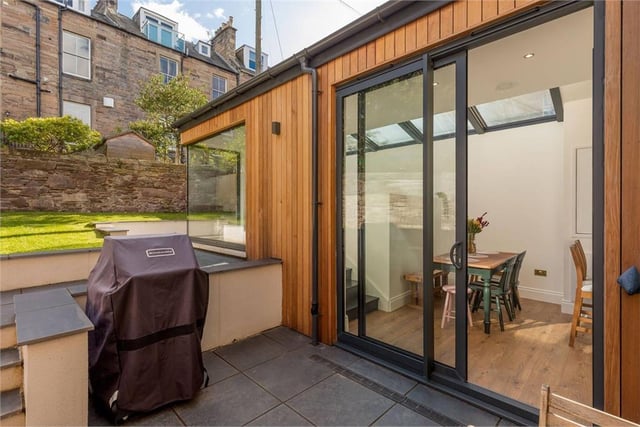 Sliding doors give access from extension to patio area.