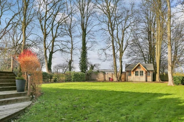 The total size of the plot, on which the house stands, is 0.56 acres. The back includes this large lawn.