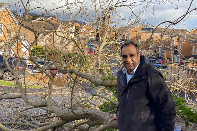 Councillor Shaffaq Mohammed in front of the tree which narrowly missed his car on Stoneacre Drive in Owlthorpe, Sheffield during Storm Malik on Saturday, January 29