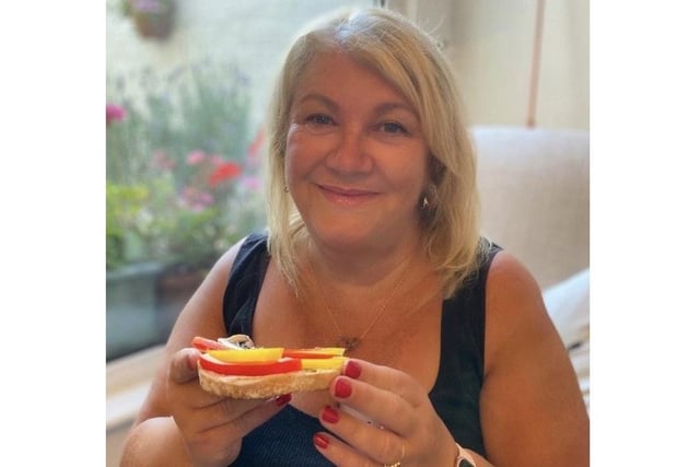 Caroline Barnes, a human resources business partner at the University of Portsmouth, has been recreating famous paintings on her toast. Pictured: Caroline enjoying some of her toast