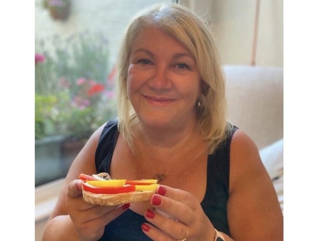Caroline Barnes, a human resources business partner at the University of Portsmouth, has been recreating famous paintings on her toast. Pictured: Caroline enjoying some of her toast