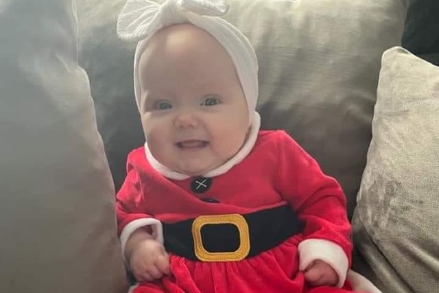 We're loving Mia-Belle's adorable Santa outfit.