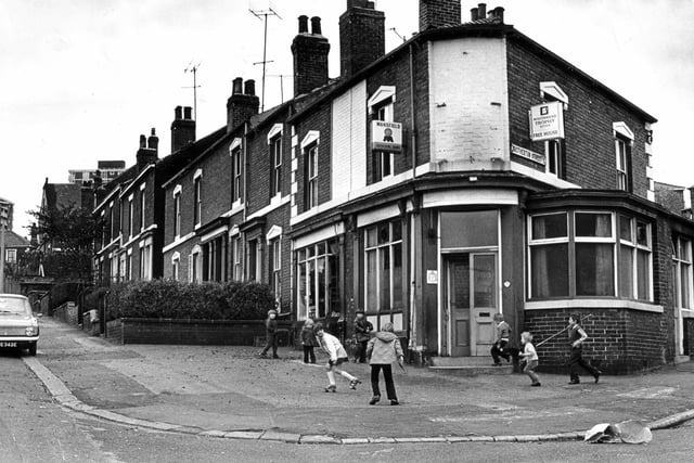 Children play in the street outside the Catherine Arms pub in Burngreave, Sheffield, October 28, 1974