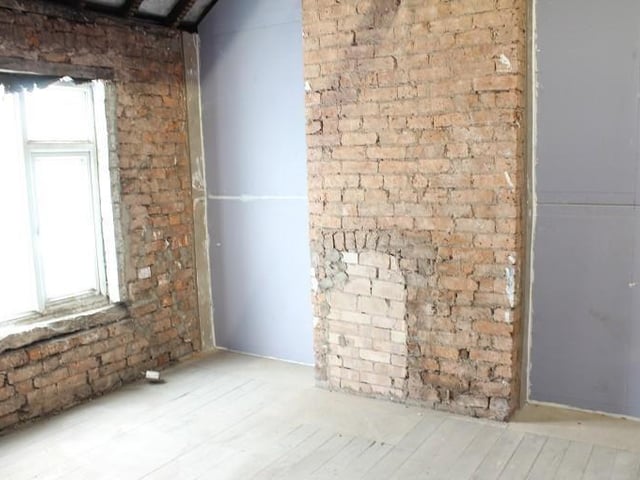 The second bedroom is smaller than the other one, but it's still suitable out for a nice facelift. A window overlooks the front of the property.