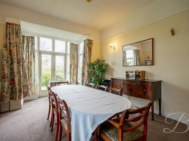 The second dining room has French doors onto the garden.