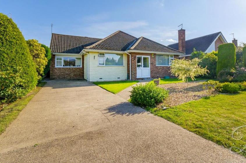 A long driveway, offering ample off-street parking, leads to the three-bedroom, detached bungalow on Southpark Avenue in Mansfield. The garden also features a lawn and pathway to the front door.