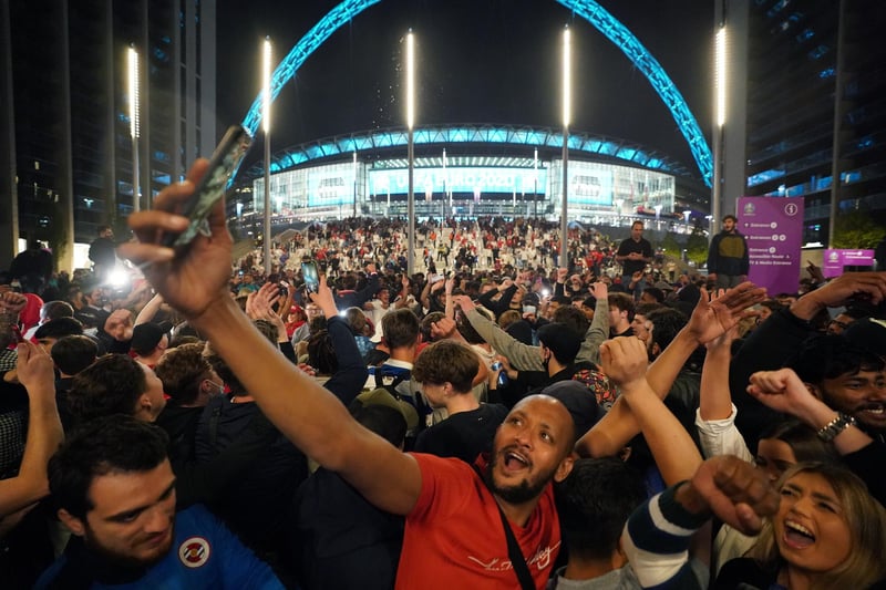 England fans celebrate outside Wembley Stadium after England qualified for the Euro 2020 final.