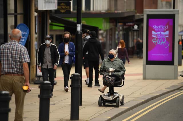 Shoppers wear face masks in the city centre of Sheffield. (Photo by Oli SCARFF / AFP) (Photo by OLI SCARFF/AFP via Getty Images)