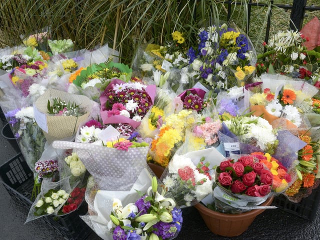 Floral tributes have been left close to the murder scene.