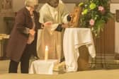 Christin Wood, from St Mary’s Penistone, and St Marie's seminarian Christian Nwakamma display an icon of Our Lady of Perpetual Succour at the opening celebration for the Synod on Synodality in the Diocese of Hallam.