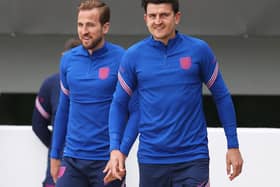 Harry Kane and Harry Maguire of England walk out prior to the England Training Session at St George's Park before moving onto Rome (Photo by Catherine Ivill/Getty Images)