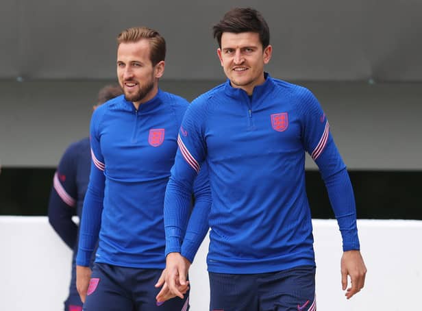 Harry Kane and Harry Maguire of England walk out prior to the England Training Session at St George's Park before moving onto Rome (Photo by Catherine Ivill/Getty Images)