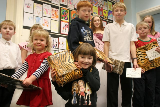 New Mills carnival, programme cover competition winners, overall winner six year old Courtney Shaw, centre