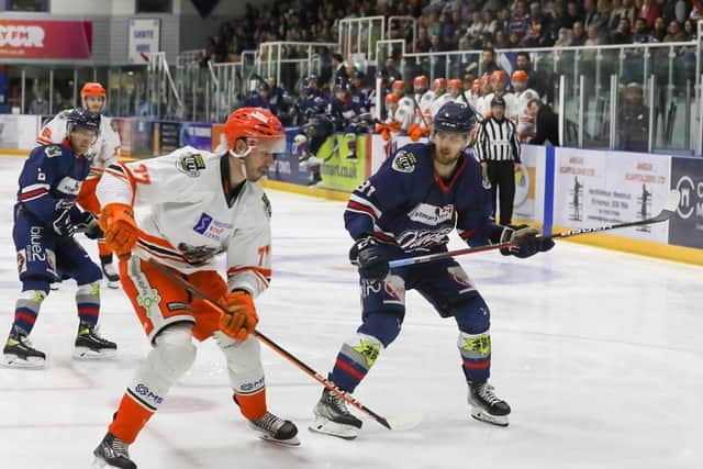 Sheffield Steelers' Keeton Ellerby poised to clear the puck against Dundee Stars. Pic by Derek Black