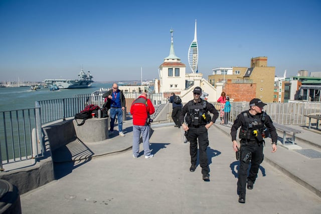 Police patrol the Round Tower as HMS Prince of Wales returns home.
