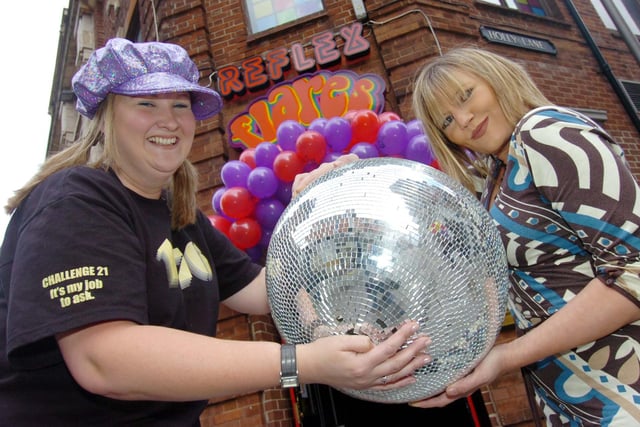 Claire Hissep passes the glitter ball from former manager Rachel Watson as she takes over at the newly opened Flares bar in West Street in 2008