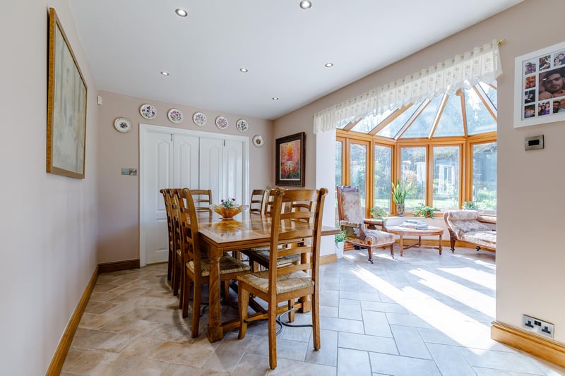 The dining area within the kitchen is open plan to the conservatory