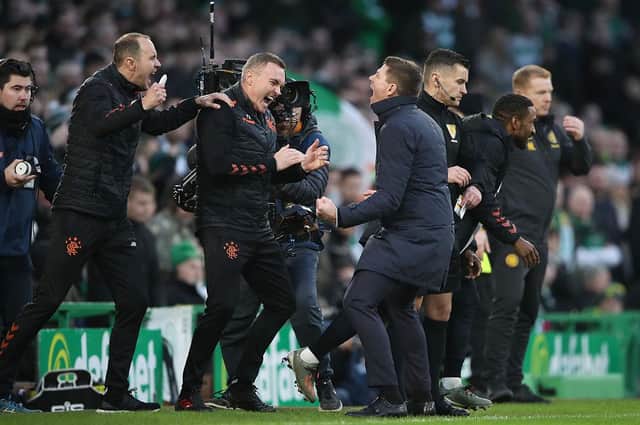 Rangers manager Steven Gerrard celebrates with backroom staff at full time after defeating Celtic. (Photo by Ian MacNicol/Getty Images)