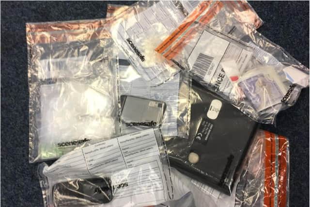 Drugs and counterfeit currency were among the items seized during a police raid in Sheffield