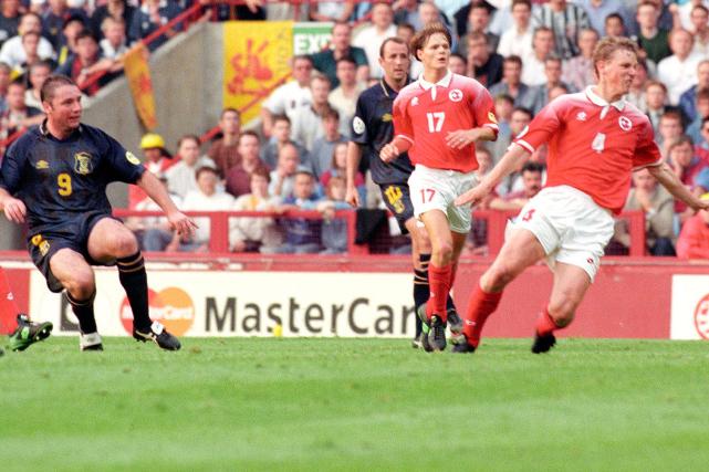 Ally McCoist's drive had Scotland through until a late consolation for Holland in a 4-1 defeat to England at Wembley edged Craig Brown's team out on goal difference after amassing four points.