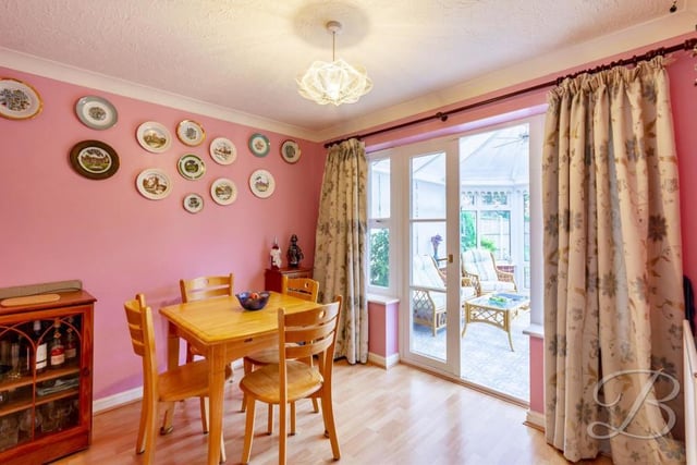 From the living room, find your way into this dining room, which is the ideal place for a family meal. As you can see, it has access to the conservatory.