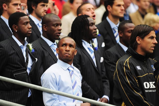 Cup-tied Jermain Defoe of Portsmouth looks on during the anthems. Photo by Shaun Botterill/Getty Images